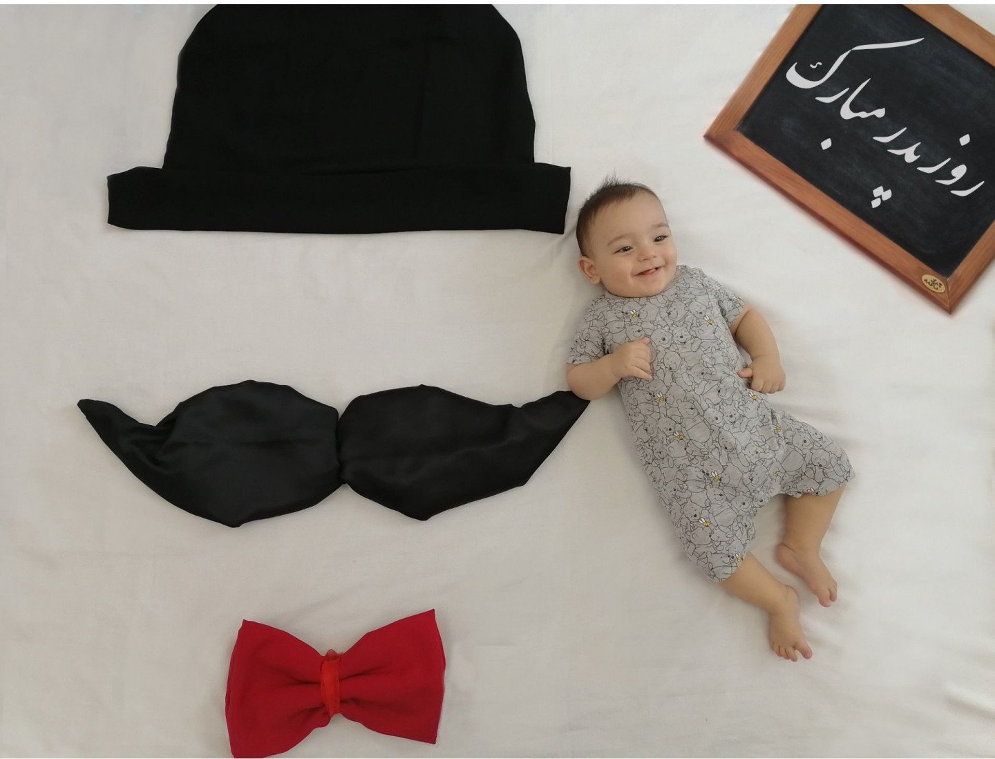 عکس نوزاد با پدر تایماز حاتمی زاده